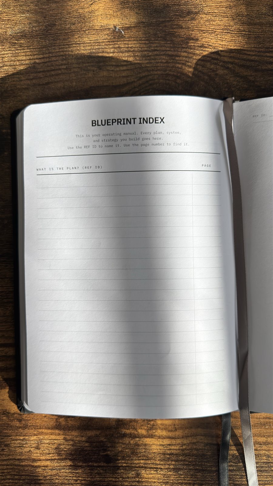 Blueprint dot-grid page with black thumb index and REF ID